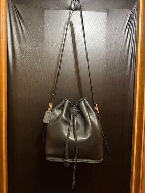 Authenic Coach Black cowhide Leather bucket purse with drawstrings.